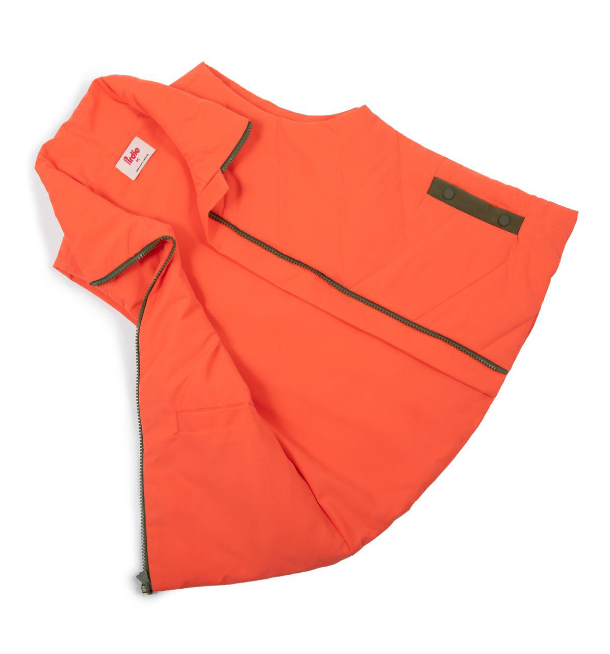 Flay lay of Coral Twilight womens golf Vest showing the inside on the left side