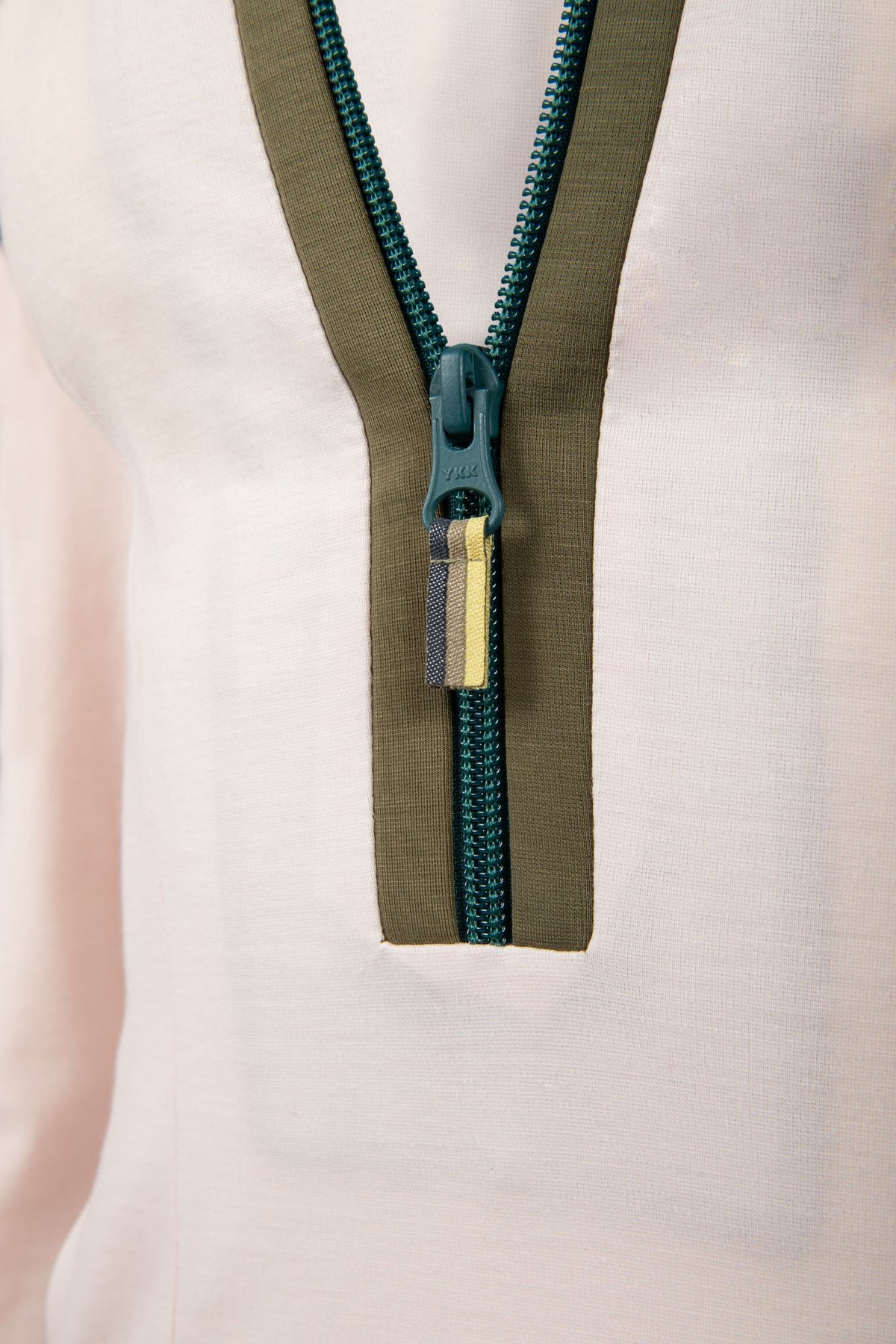 Close up of White Dutchess womens golf long sleeve dress teal zipper