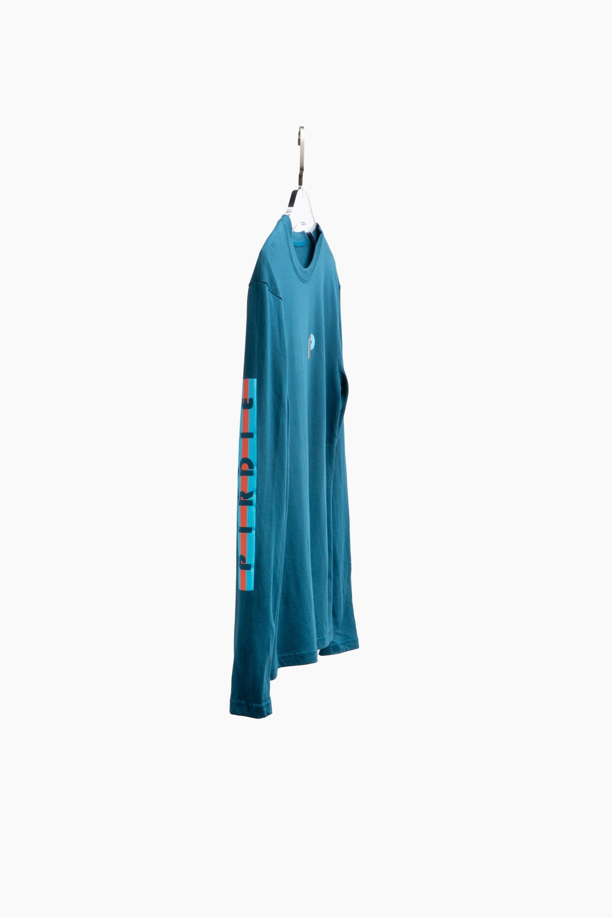 Pirdie's long sleeve golf t-shirt in teal on hanger.