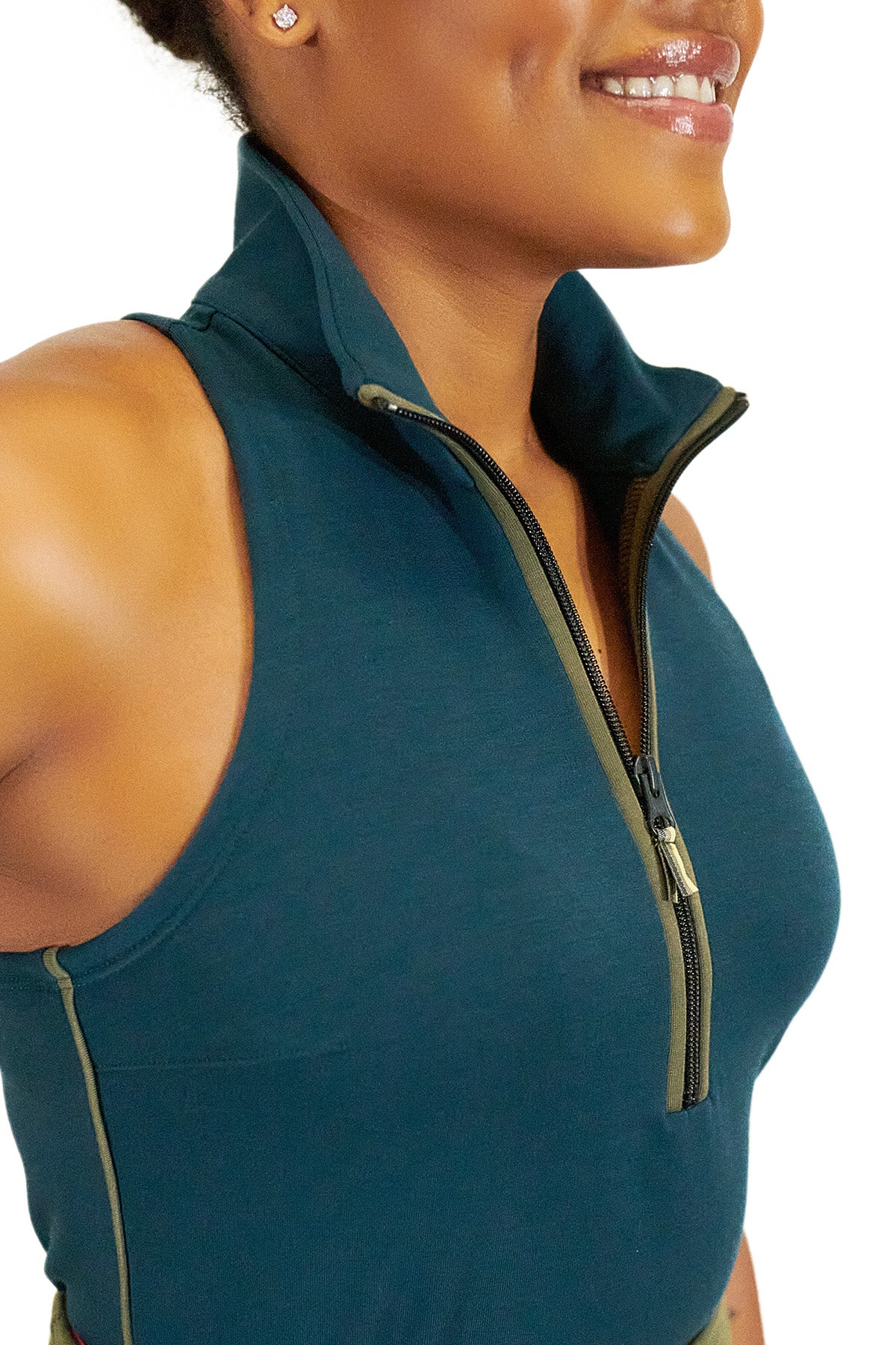 Model wearing Teal Back Nine womens golf sleeveless shirt with black zipper
